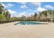 Community pool showcasing a large swimming pool and playground area at 213 Florence Dr, Clayton, NC 27527