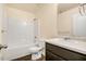 Clean bathroom features white fixtures, including a tub with shower, toilet, and vanity with sink at 221 Hallow Oak St, Spring Lake, NC 28390