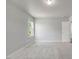 Bright bedroom features neutral carpeting, a window and a white door at 221 Hallow Oak St, Spring Lake, NC 28390