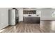Spacious kitchen featuring stainless steel appliances, a large island, and modern gray vinyl floors at 221 Hallow Oak St, Spring Lake, NC 28390