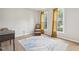 Bright bedroom with lots of natural light, hardwood floors, and a charming accent rug at 2317 Colony Woods Dr, Apex, NC 27523