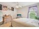 Charming bedroom with dresser, natural lighting, patterned drapes, and personal decor at 2317 Colony Woods Dr, Apex, NC 27523