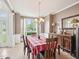 Formal dining room featuring a chandelier, large window, and classic furnishings at 2317 Colony Woods Dr, Apex, NC 27523