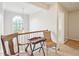 Hallway with hardwood railing, hanging lamp, transom window, and carpeted floor at 2317 Colony Woods Dr, Apex, NC 27523