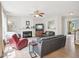 Cozy living room with a fireplace, comfortable seating, and hardwood floors at 2317 Colony Woods Dr, Apex, NC 27523