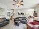Spacious living room with hardwood floors, a ceiling fan, and ample seating at 2317 Colony Woods Dr, Apex, NC 27523