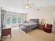 Main bedroom features a ceiling fan and plenty of natural light from large windows at 2317 Colony Woods Dr, Apex, NC 27523