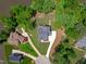 An aerial view of a lakefront home showing the roof line and lawn at 248 Ashford Dr, Pittsboro, NC 27312