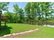 Inviting backyard with lush green grass and scenic lake views at 248 Ashford Dr, Pittsboro, NC 27312