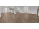 Finished basement with wood grain floors, white trim and a wet bar at 248 Ashford Dr, Pittsboro, NC 27312
