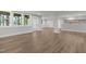 Finished basement with wood grain floors, white trim, and several windows at 248 Ashford Dr, Pittsboro, NC 27312