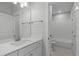 Bathroom features white shower and bath combo and single sink vanity with quartz countertop at 248 Ashford Dr, Pittsboro, NC 27312