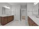 Spacious bathroom with double vanities, marble floors, and ample lighting at 248 Ashford Dr, Pittsboro, NC 27312