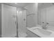 Bathroom featuring walk-in shower with glass door, white subway tile, and a white vanity with quartz countertop at 248 Ashford Dr, Pittsboro, NC 27312