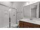 Bathroom features white shower with glass door and single sink vanity with quartz countertop at 248 Ashford Dr, Pittsboro, NC 27312