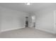 Spacious bedroom with neutral carpet with attached bathroom and staircase access at 248 Ashford Dr, Pittsboro, NC 27312
