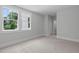 Bright bedroom with carpet, large windows, and white trim at 248 Ashford Dr, Pittsboro, NC 27312