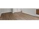 Empty bedroom featuring hardwood floors and base trim molding, and two doors at 248 Ashford Dr, Pittsboro, NC 27312