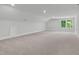 Spacious bonus room with neutral carpet, recessed lighting, and a large window at 248 Ashford Dr, Pittsboro, NC 27312