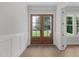 Inviting foyer with wood flooring and elegant double doors, creating a grand entrance at 248 Ashford Dr, Pittsboro, NC 27312