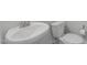 Modern powder room with a white toilet and sink, complimented by sleek chrome fixtures at 248 Ashford Dr, Pittsboro, NC 27312