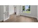 Sunlit room with wood floors, providing a flexible space for an office or playroom at 248 Ashford Dr, Pittsboro, NC 27312