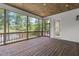 Cozy screened porch with wood floors, beadboard ceiling and views of the lake at 248 Ashford Dr, Pittsboro, NC 27312