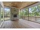 Screened in porch features a wood-burning fireplace, wood ceiling and views of the lake at 248 Ashford Dr, Pittsboro, NC 27312