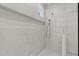 Bathroom shower featuring marble tile, glass surround, and dual shower heads at 248 Ashford Dr, Pittsboro, NC 27312