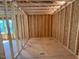 Bedroom featuring exposed wood framing and a large window for natural light at 253 Inspiration Way, Fuquay Varina, NC 27526