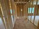 Hallway with exposed wood framing and natural light from several windows at 253 Inspiration Way, Fuquay Varina, NC 27526