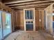 Living room featuring a framed fireplace ready for customization, creating a focal point for a cozy living space at 253 Inspiration Way, Fuquay Varina, NC 27526