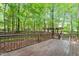 Exterior view showing a wooden deck and wooded surroundings at 2612 Wade Hampton Rd, Hillsborough, NC 27278