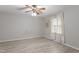 Bright bedroom with light gray walls, wood-look flooring, and natural light at 2612 Wade Hampton Rd, Hillsborough, NC 27278