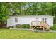 Charming single-story home featuring a wooden deck and well-maintained lawn at 2612 Wade Hampton Rd, Hillsborough, NC 27278