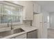 Bright kitchen featuring stainless steel appliances, white cabinets, and updated countertops at 2612 Wade Hampton Rd, Hillsborough, NC 27278