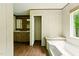 Bathroom featuring a double vanity and bathtub, offering convenience and a spa-like experience at 2832 Ladale Ln, Mebane, NC 27302
