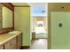 Bathroom vanity and shower, offering a clean and functional space with natural light at 2832 Ladale Ln, Mebane, NC 27302