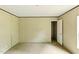 A vacant room showing light walls, and a door leading to another space at 2832 Ladale Ln, Mebane, NC 27302
