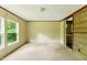 Bright bedroom features large windows with scenic views and neutral carpet, creating a relaxing retreat at 2832 Ladale Ln, Mebane, NC 27302