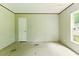A bright room featuring neutral walls, an interior door, and a window bringing in natural light at 2832 Ladale Ln, Mebane, NC 27302