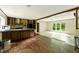 Open-concept kitchen and living area with wood cabinets, modern appliances, and ample counter space at 2832 Ladale Ln, Mebane, NC 27302