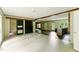 Open-concept living space, connecting the kitchen and living areas, with tile and hardwood floors, and bright natural light at 2832 Ladale Ln, Mebane, NC 27302