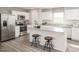 Modern kitchen with stainless steel appliances, granite countertops, and a large island at 298 Day Farm Dr, Lillington, NC 27546