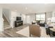 Cozy living room featuring gray sofas, neutral decor, and ample natural light at 298 Day Farm Dr, Lillington, NC 27546