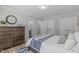Comfortable bedroom showcases wood floors, neutral decor, and ample closet space at 3 Haggis Ct, Durham, NC 27705