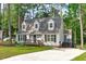 Charming Cape Cod-style home with a well-maintained lawn and inviting front porch, nestled among mature trees at 3 Haggis Ct, Durham, NC 27705