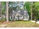 Charming Cape Cod home featuring dormer windows, a cozy front porch, and a well-maintained lawn at 3 Haggis Ct, Durham, NC 27705