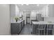 Stylish kitchen with white cabinets, gray lower cabinets, stainless steel appliances and subway tile backsplash at 3 Haggis Ct, Durham, NC 27705
