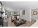 Open-concept living area with a fireplace, comfortable seating, and seamless transition to the dining area at 3 Haggis Ct, Durham, NC 27705
